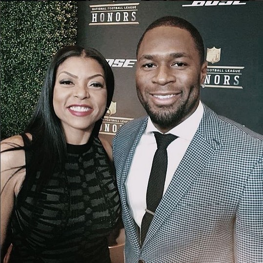 Taraji P. Henson wearing black and Kelvin Hayden in checkered suit